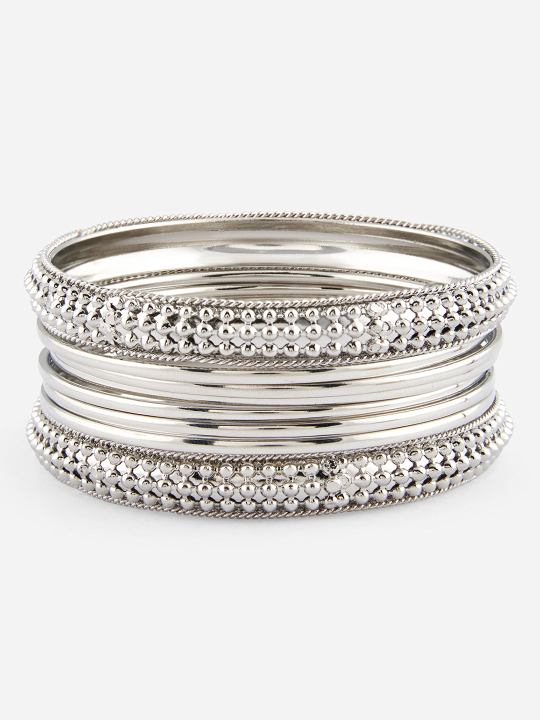 Set of silver bangles on a white background