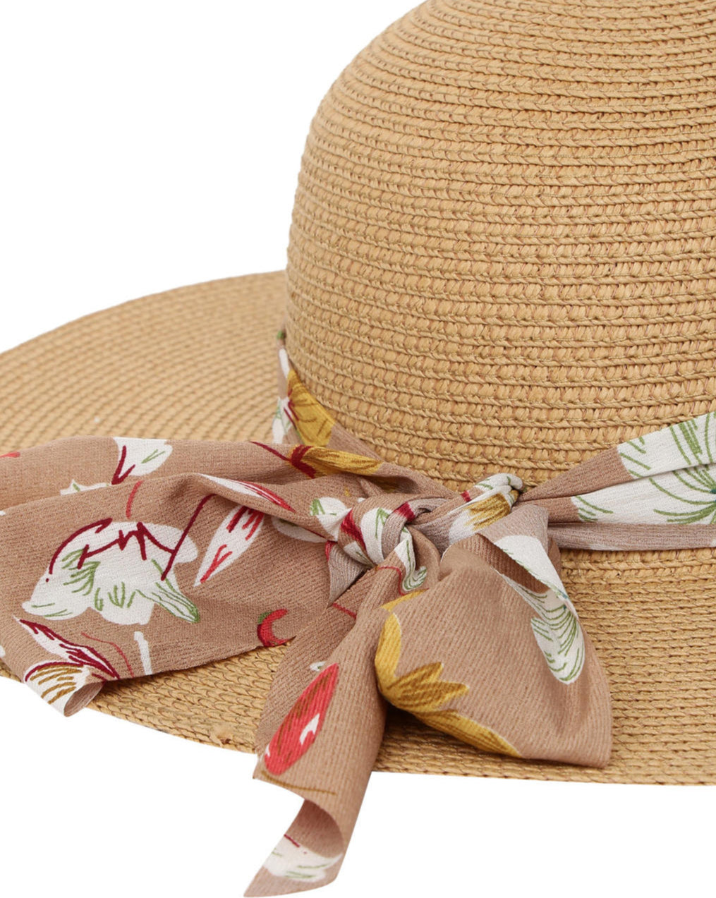 A beige beach hat with a soft brown multicolor floral printed scarf around the base.