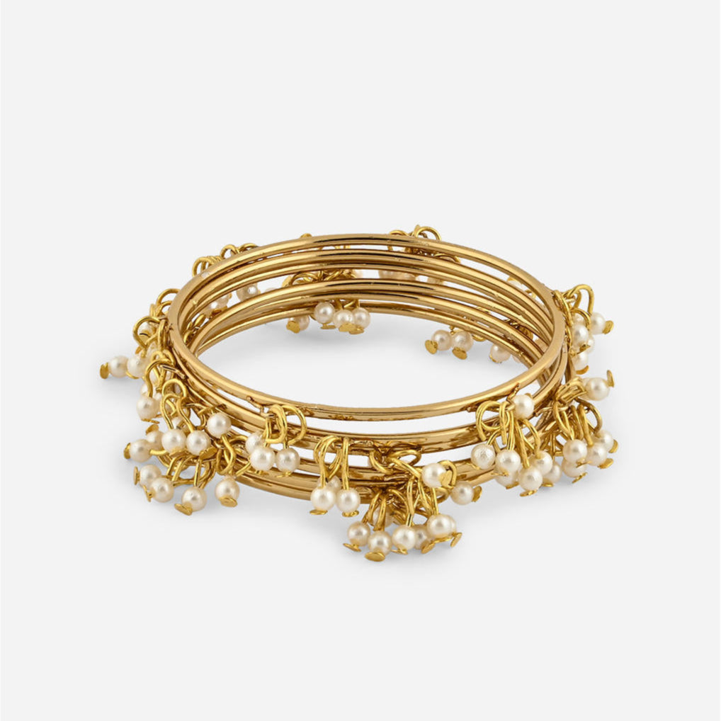 gold-plated bangles with delicate white pearl drop detailing, elegant Indian jewellery for women, perfect for weddings, bridal looks, and traditional ethnic outfits