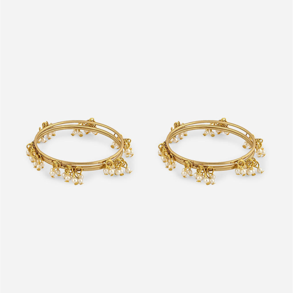 gold-plated bangles with delicate white pearl drop detailing, elegant Indian jewellery for women, perfect for weddings, bridal looks, and traditional ethnic outfits