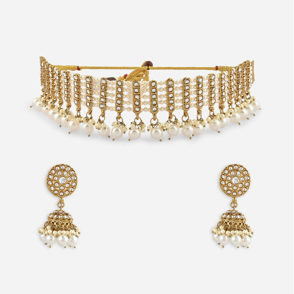 a white pearl and gold statement choker necklace and matching earrings set