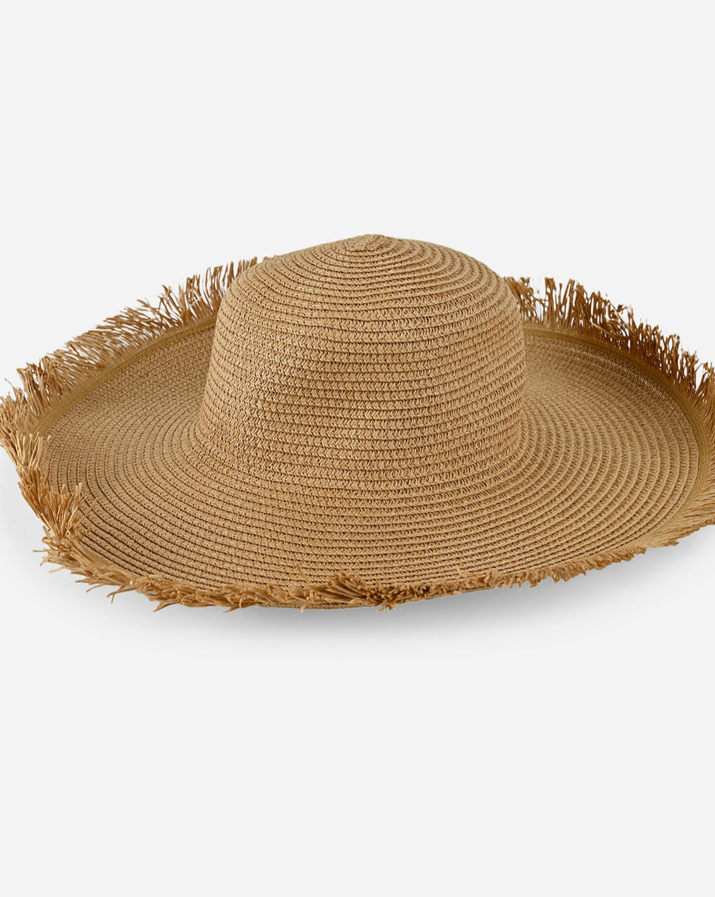 Round woven placemat with fringed edges on a white background side view