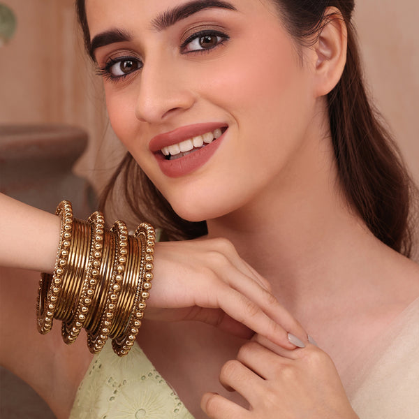 Set of 20 Traditional Golden Bangles with Beaded Accents (2.8)