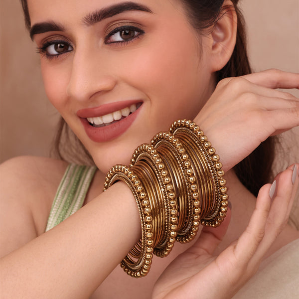 Set of 20 Traditional Golden Bangles with Beaded Accents (2.8)