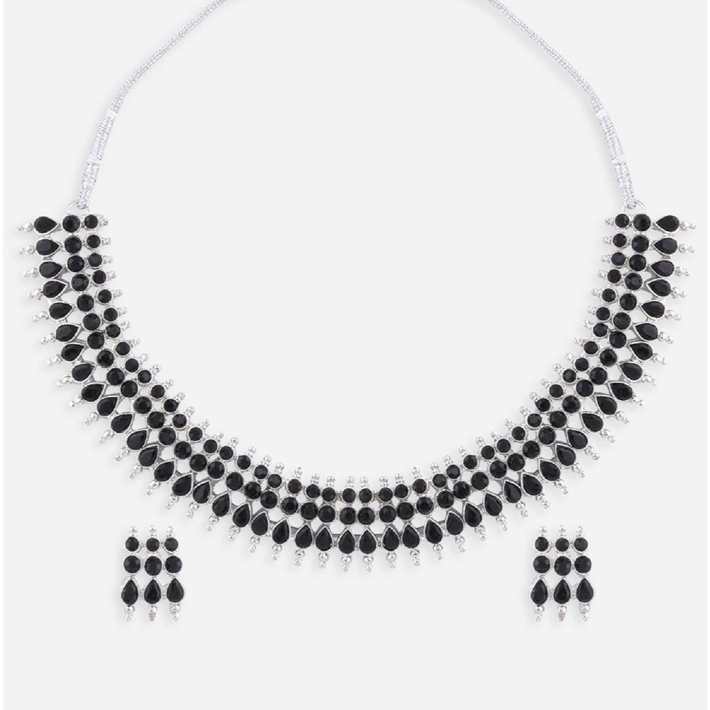 a traditional silver choker necklace with black beads and matching earrings.