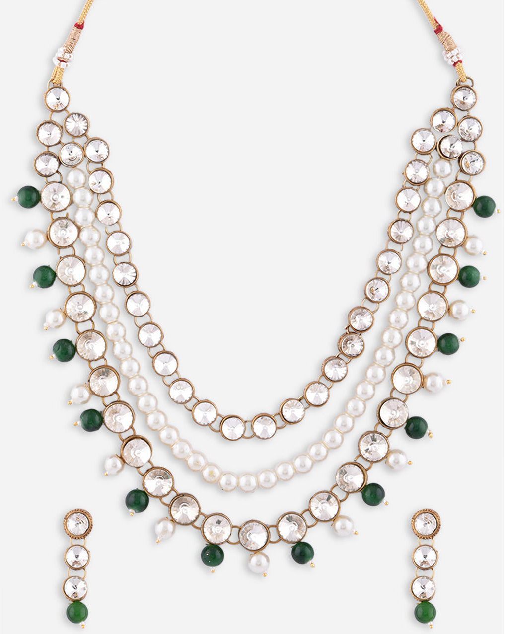 a gold plated necklace with green pearl beaded layers and matching earrings close-up