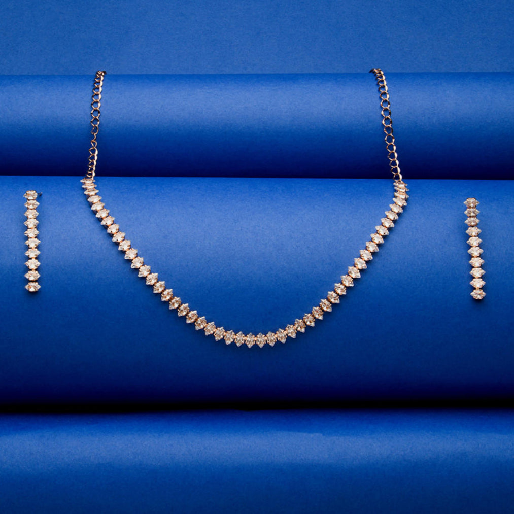 a rose gold plated necklace and earrings jewellery set with intricate motifs and American Diamond stones.