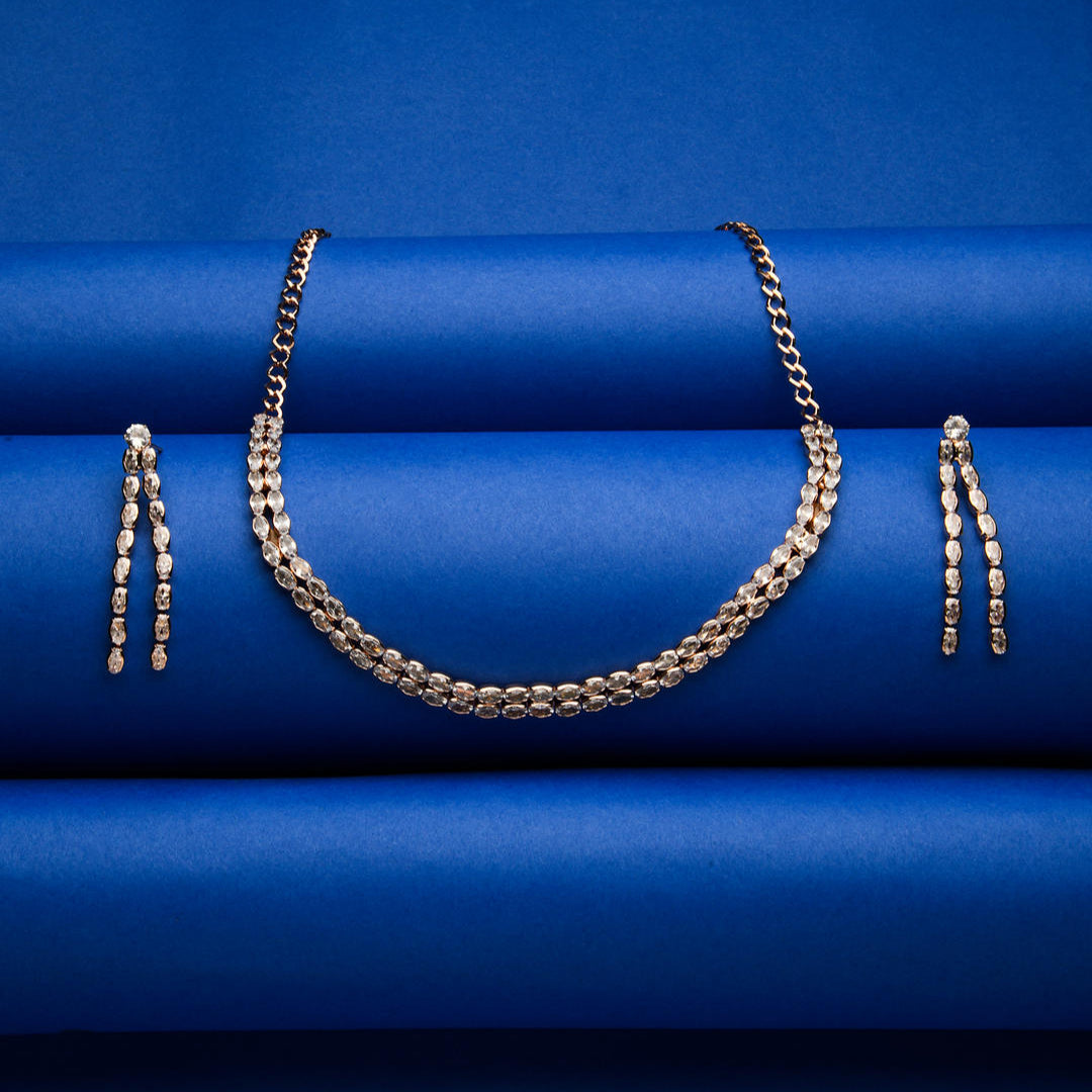 a rose gold plated double layered jewellery set with a necklace and earrings.