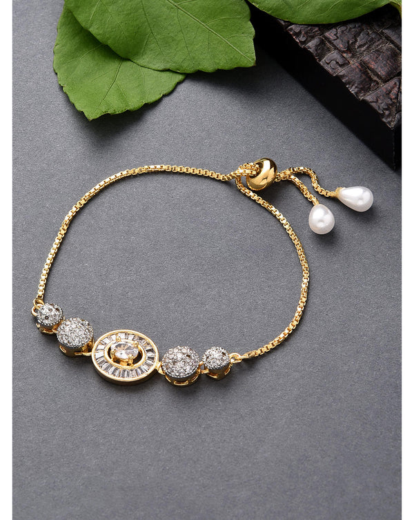 A gold plated bracelet with round charms and American diamond stones, having an adjustable chain with a leafy background.