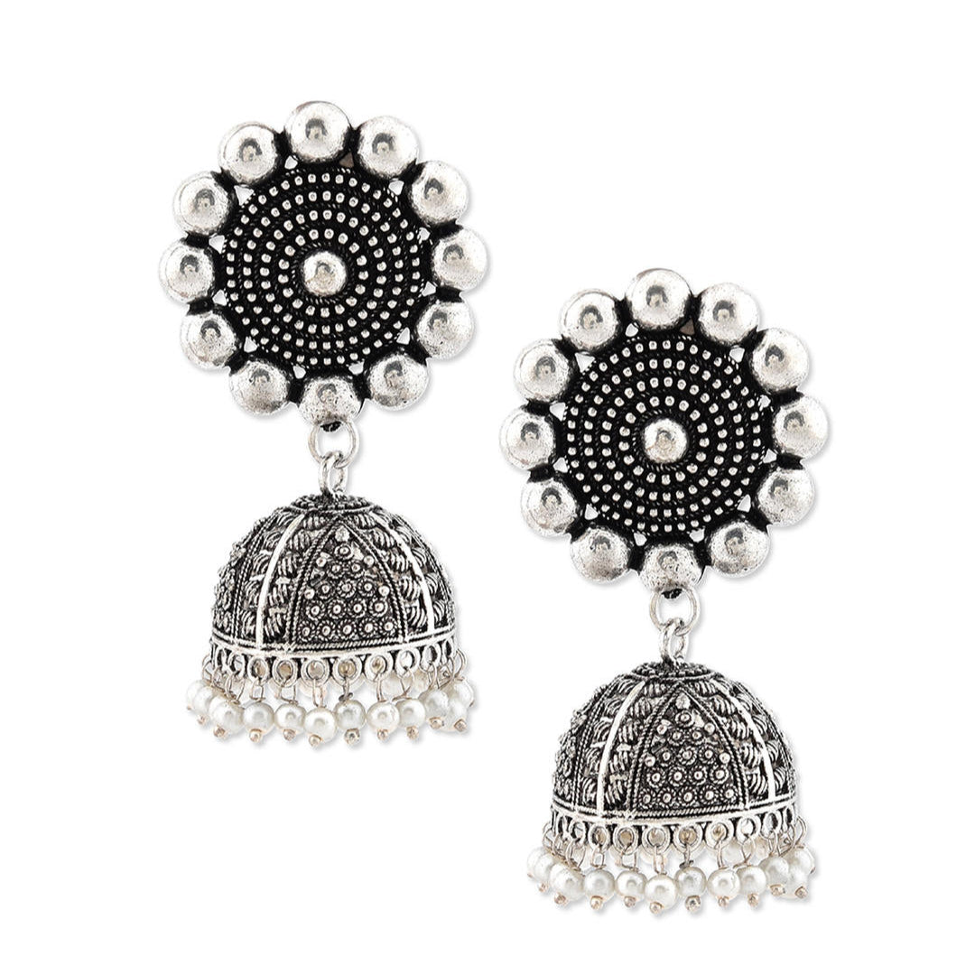 a silver oxidized matte finish floral jhumka earring.