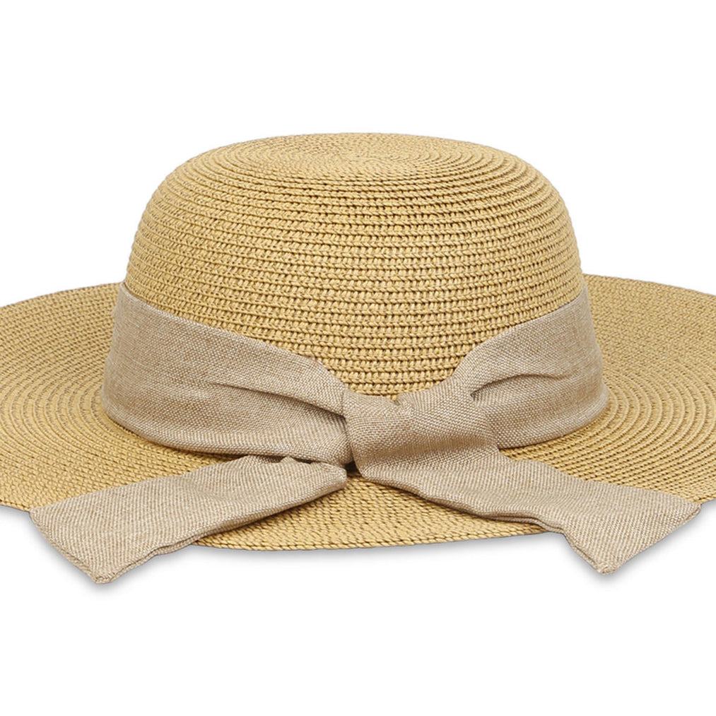 A beige beach hat made from papyrus with a khaki scarf tied around the base.