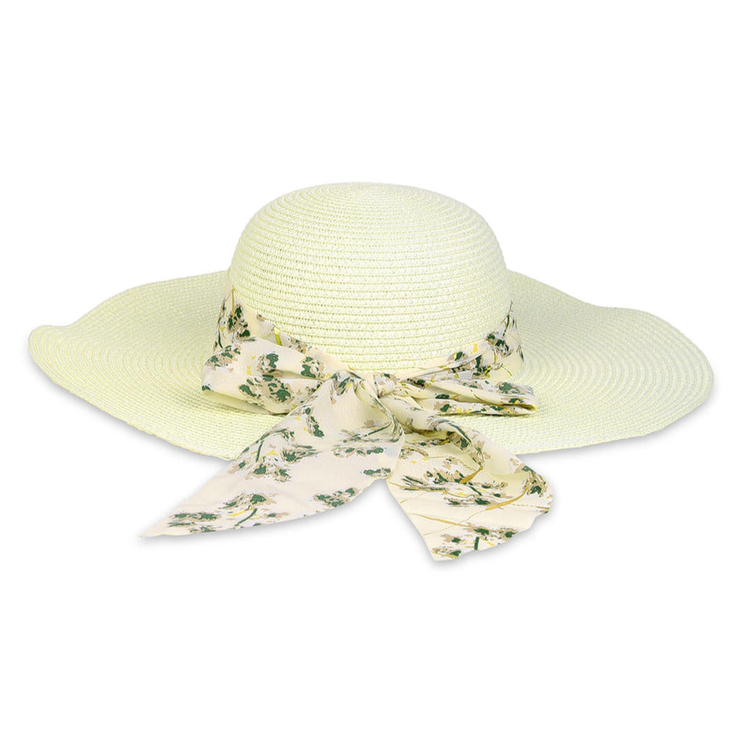 A white beach hat with an ivory floral scarf tied around the brim.