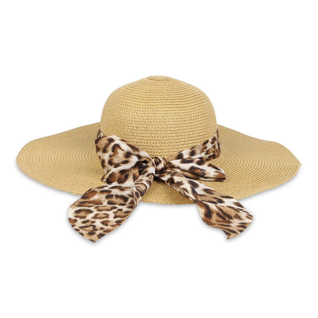A beige beach hat with a wide brim, adorned with a leopard print scarf.