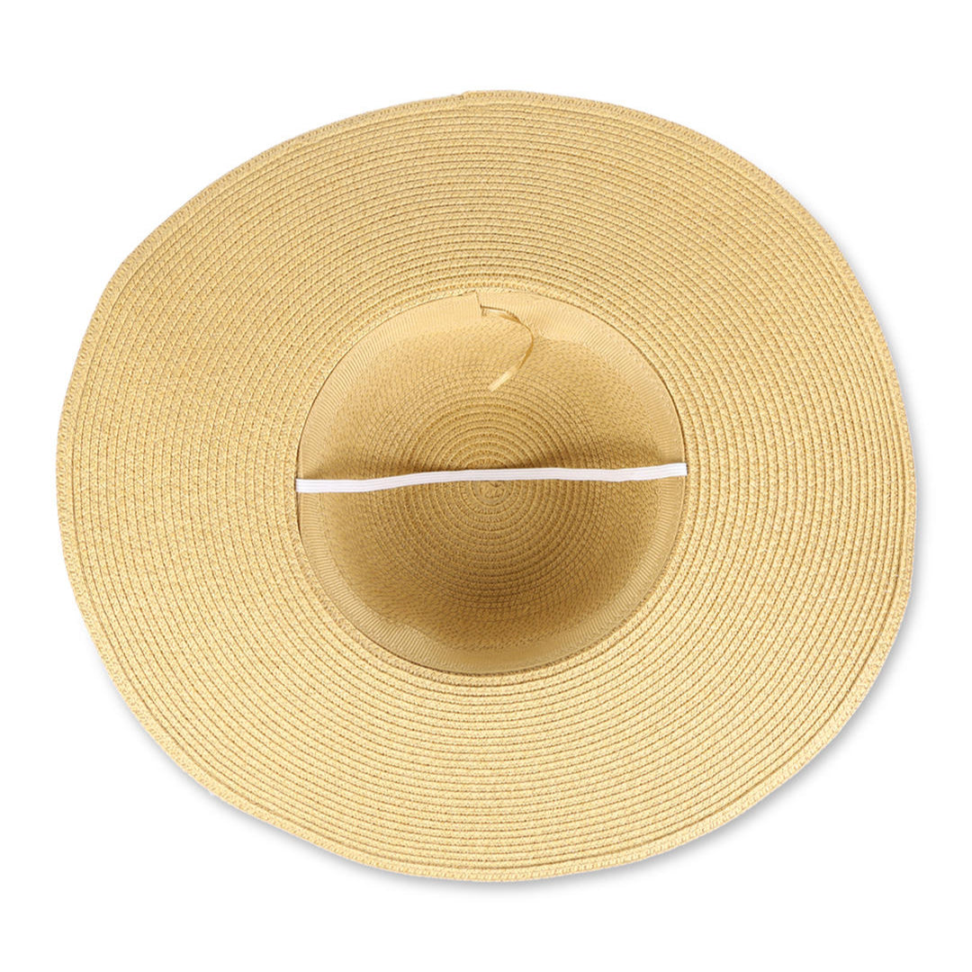 A beige beach hat with a wide brim, adorned with a leopard print scarf.