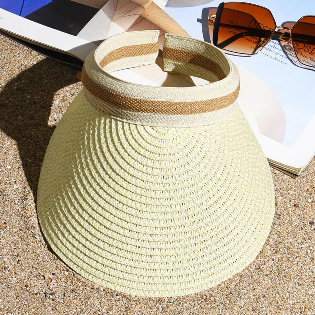 A white visor hat with a beige curved brim.