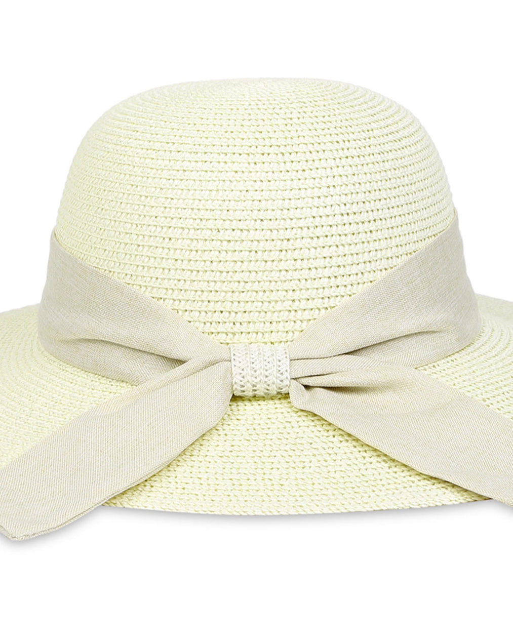 A white beach hat with a tan scarf tied around the base, made from woven straw material close-up view
