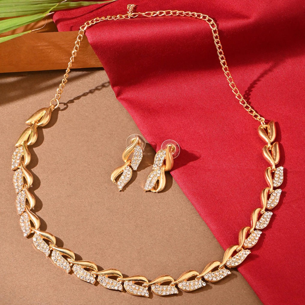 a gold-plated choker necklace and earrings with a floral design adorned with American diamonds.