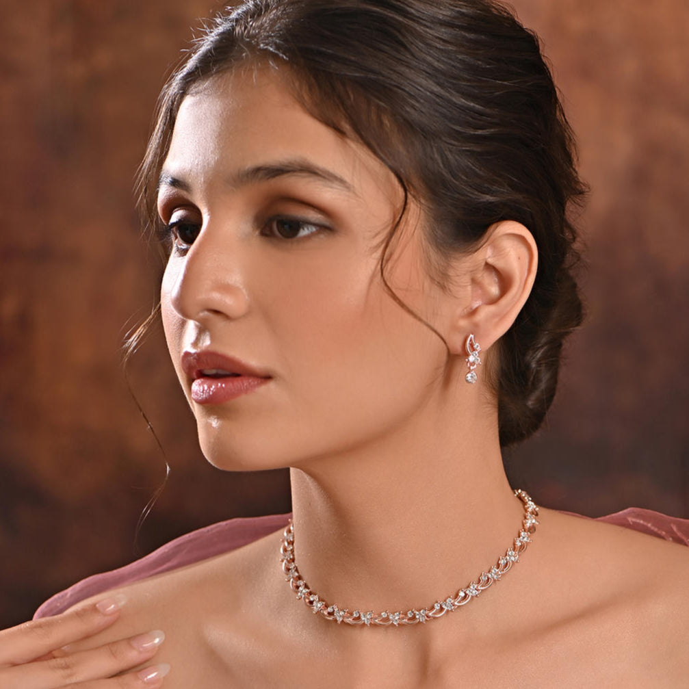 luxurious rose gold and American diamond floral party jewellery set, including a necklace and earrings.