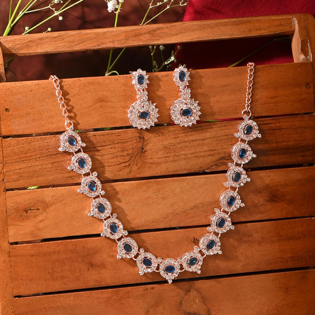 a luxurious sapphire blue floral wedding jewellery set, including a matching necklace and earrings.