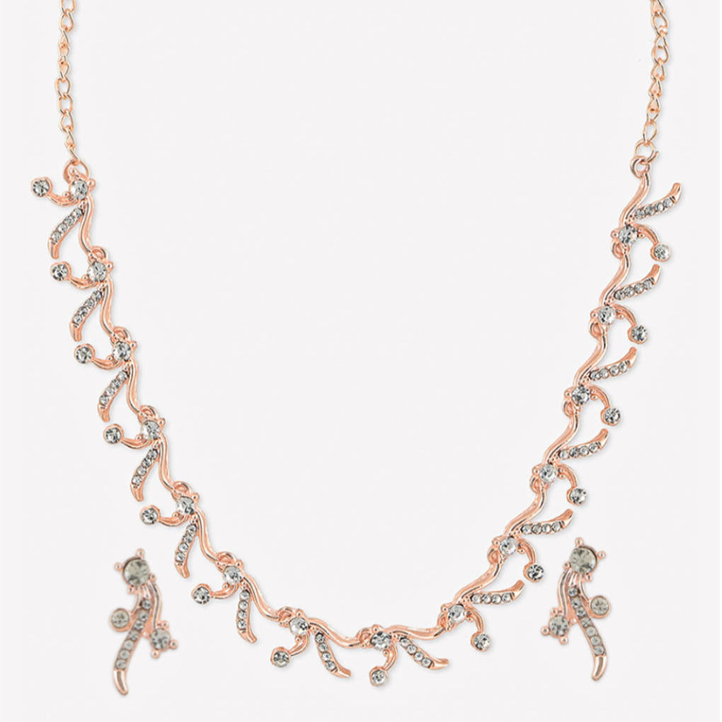 a rose gold floral party necklace and earrings set with sparkling stones.