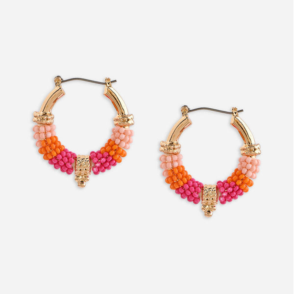 Colorful beaded hoop earrings on a white background. ToniQ jewellery is skin safe, nickel free, cadmium free, hypoallergenic, and lab tested for your comfort and trust.
