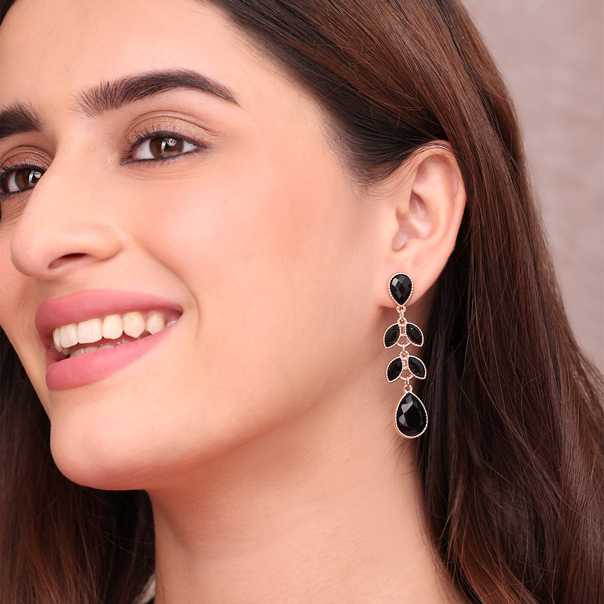 Golden Dangle Earrings with Black Teardrop Stones