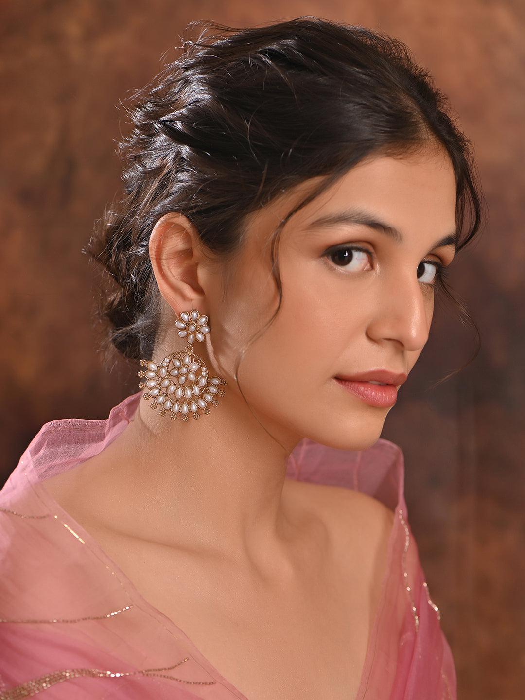 Model wearing Pearl Bloom Floral White Chandbali Earrings with gold-tone floral motifs and pearl drops, handcrafted ethnic wedding jewellery
