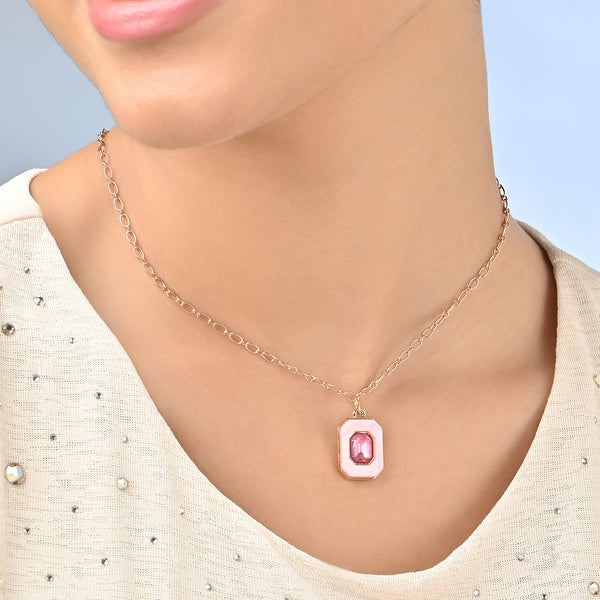 Necklace with a pink pendant on a mannequin against a light blue background