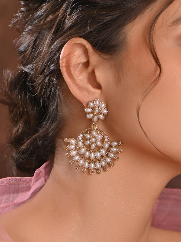 Model wearing Pearl Bloom Floral White Chandbali Earrings with gold-tone floral motifs and pearl drops, handcrafted ethnic wedding jewellery