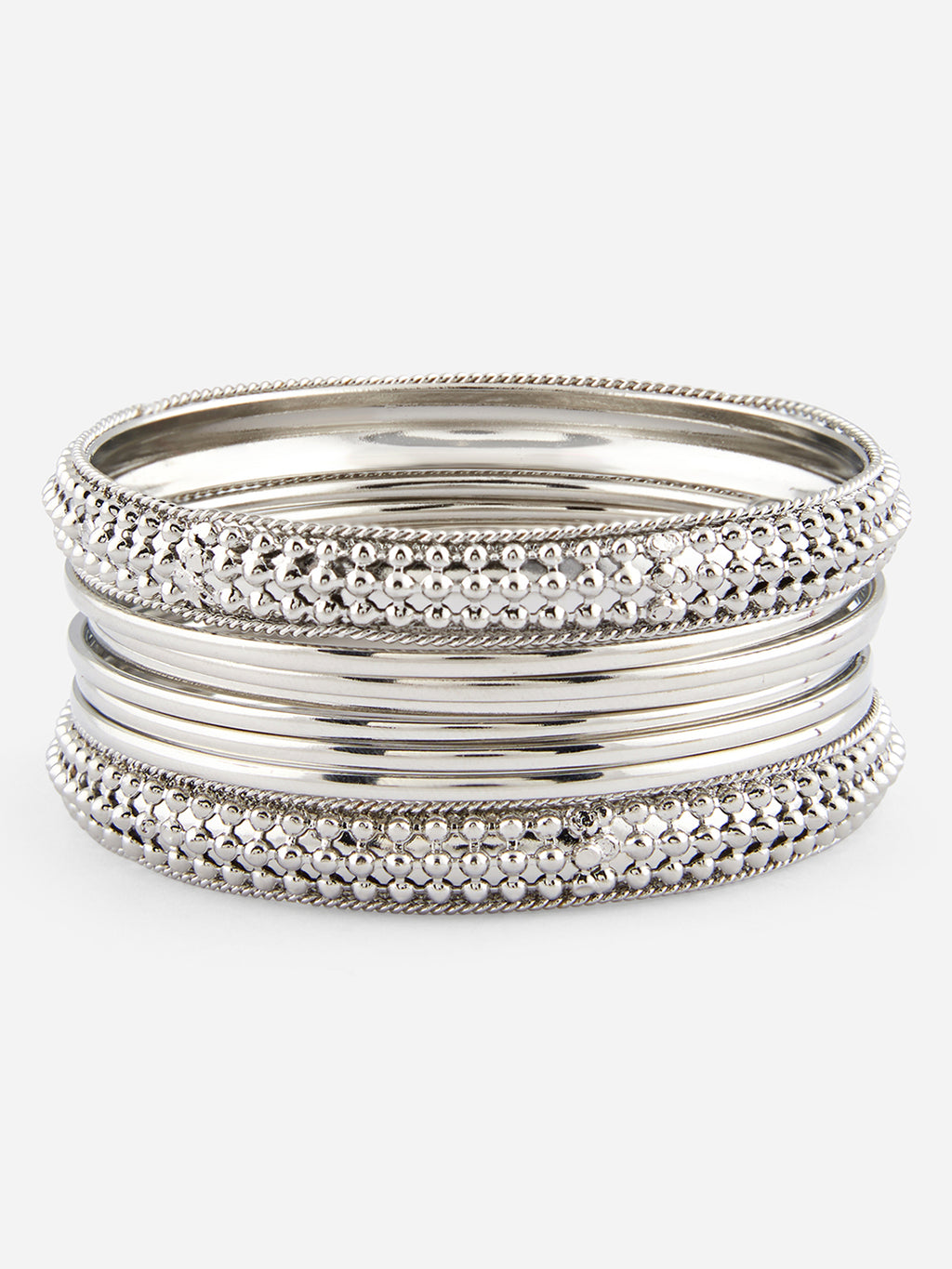 Set of silver bangles on a white background
