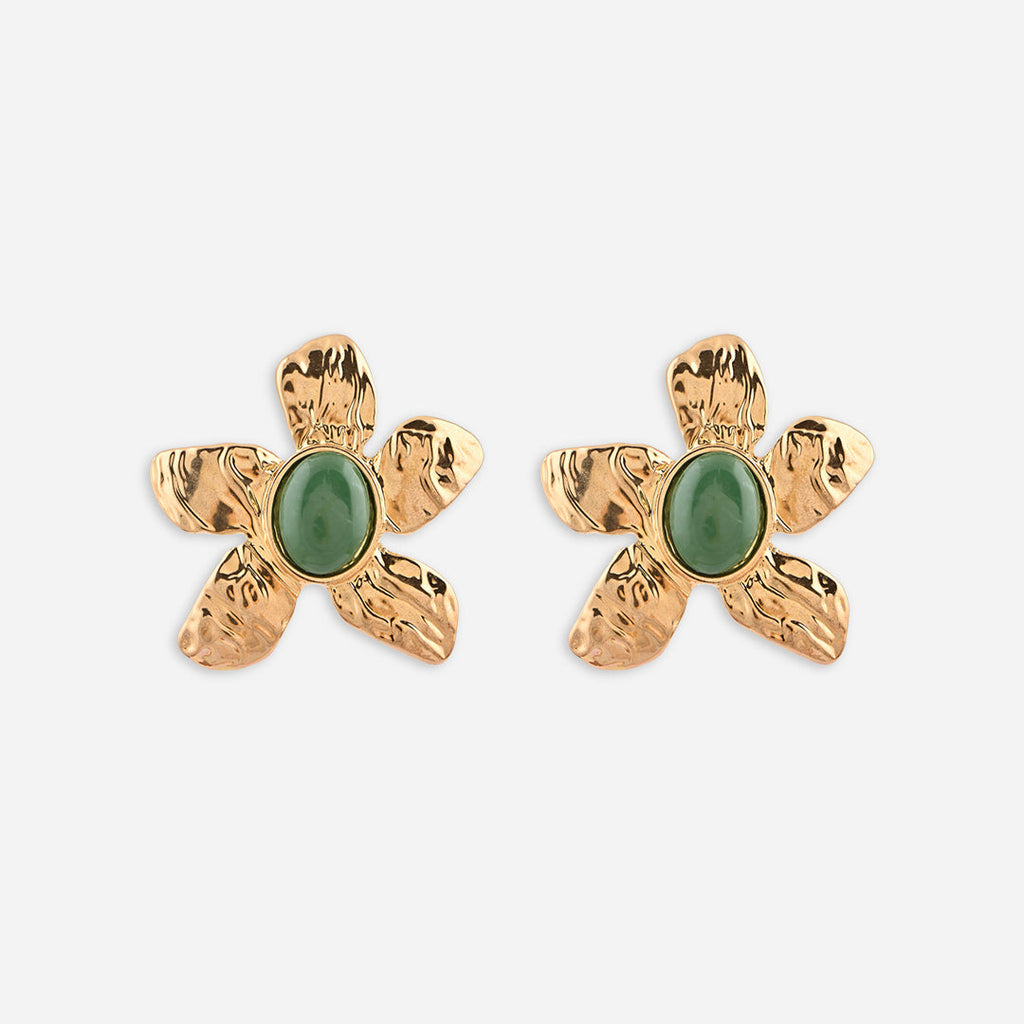 Gold flower-shaped earrings with green stones on a white background