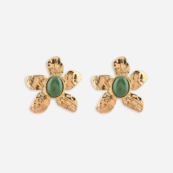 Gold flower-shaped earrings with green stones on a white background
