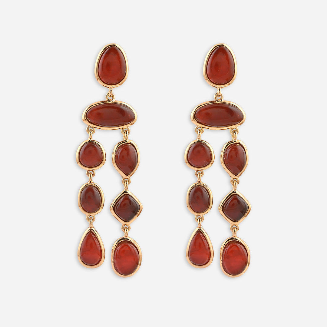 Pair of gold earrings with red stones on a white background skin safe jewellery, nickel free, cadmium free, hypoallergenic, lab tested