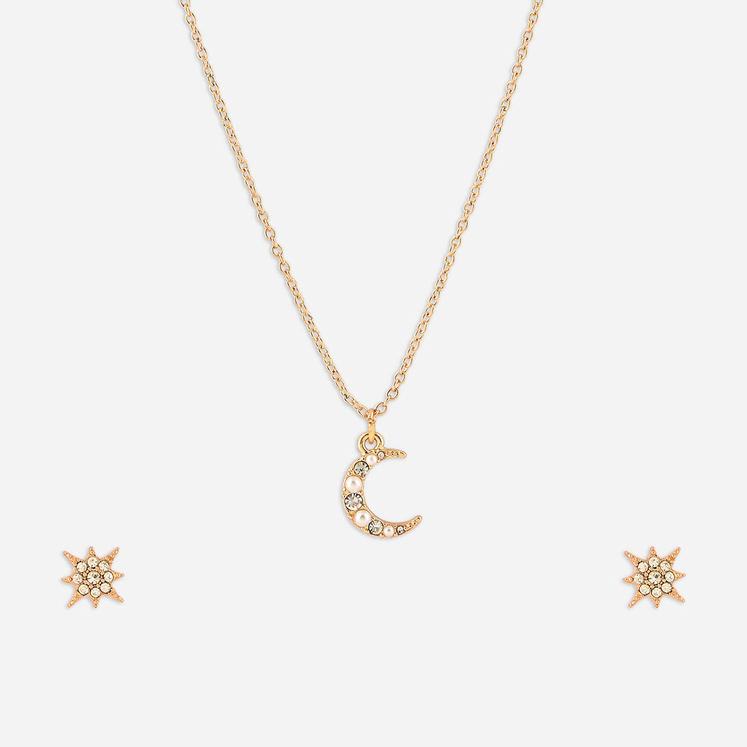 Gold necklace with a moon pendant and matching earrings on a white background