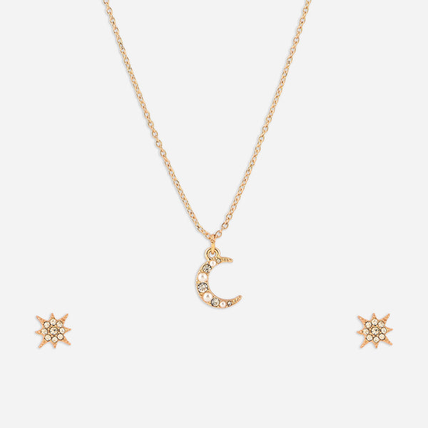 Gold necklace with a moon pendant and matching earrings on a white background
