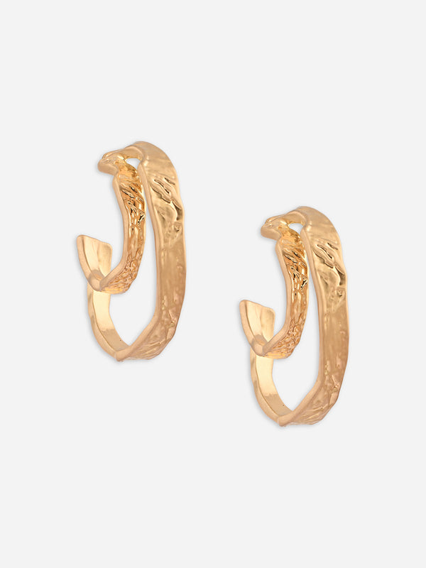 Gold hoop earrings on a light gray background