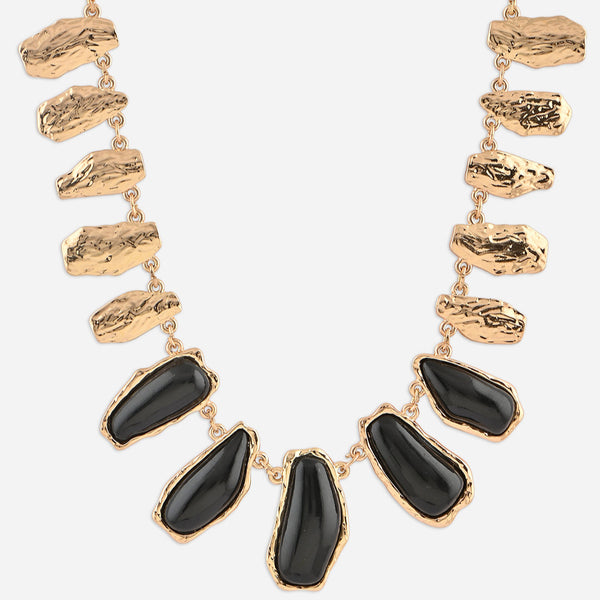 Necklace with gold and black stones on a white background