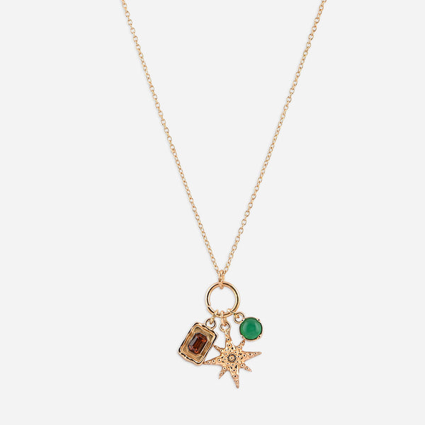 Gold necklace with three charms on a white background
