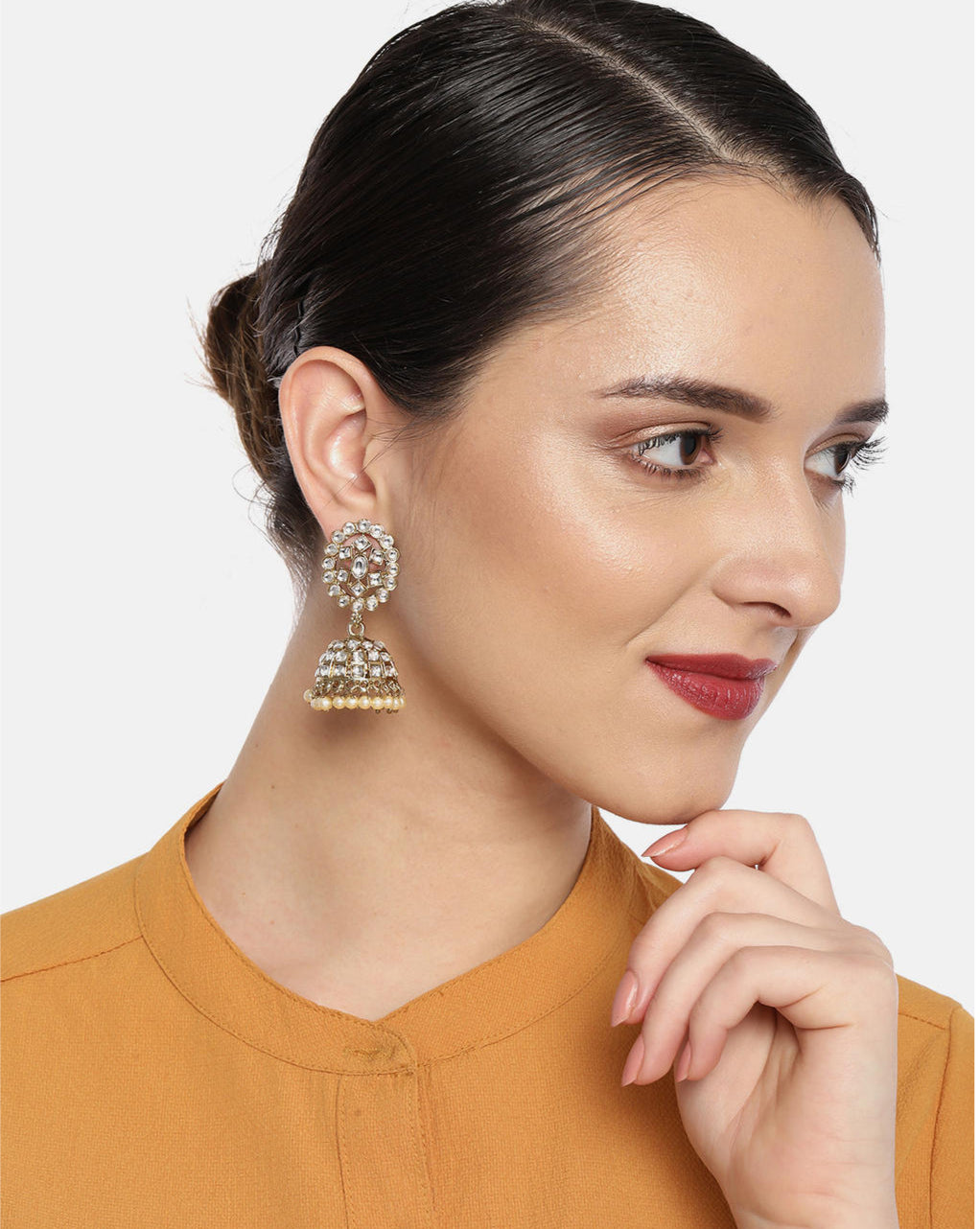 gold-plated floral jhumka earrings.
