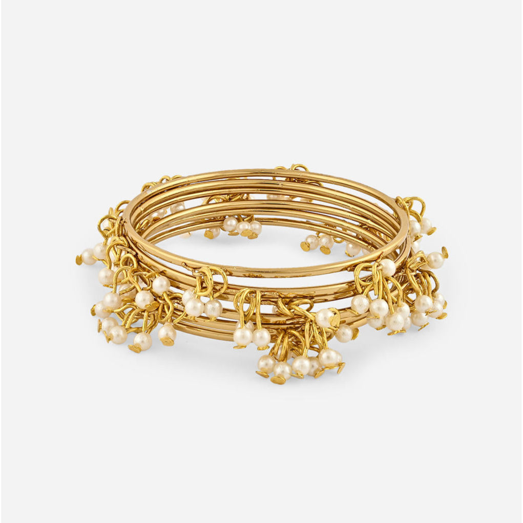 gold-plated bangles with delicate white pearl drop detailing, elegant Indian jewellery for women, perfect for weddings, bridal looks, and traditional ethnic outfits