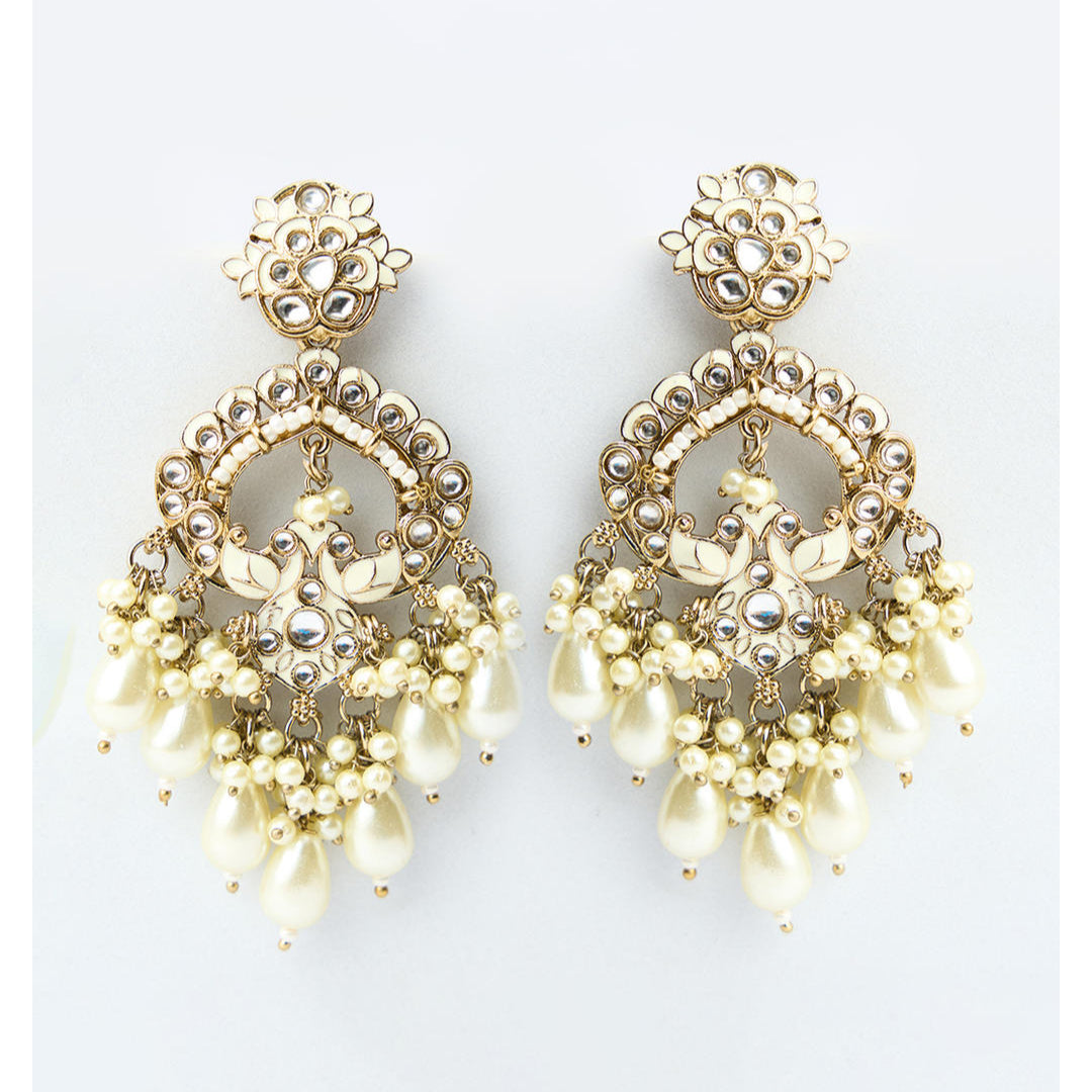 A pair of gold-toned Chandbali earrings with white Meenakari detailing and pearl drops