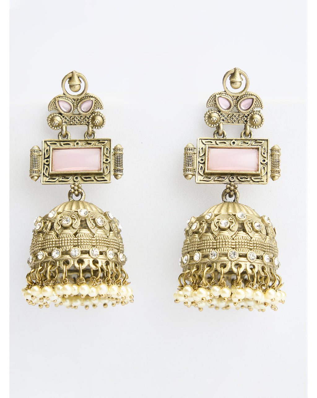 A pair of vintage jhumka earrings with pink accents and white pearl drops