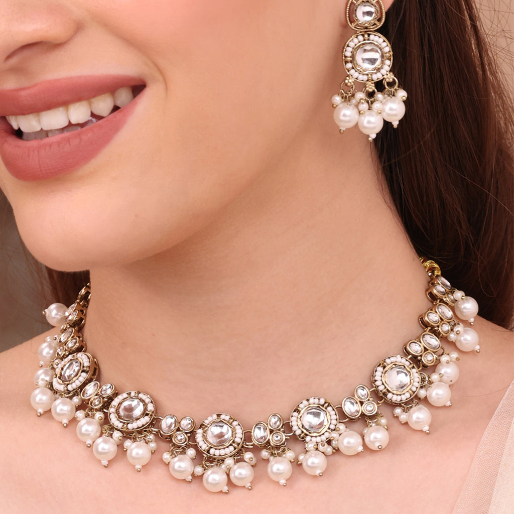 Antique Golden Jewellery Set with Kundan and Pearl Drops
