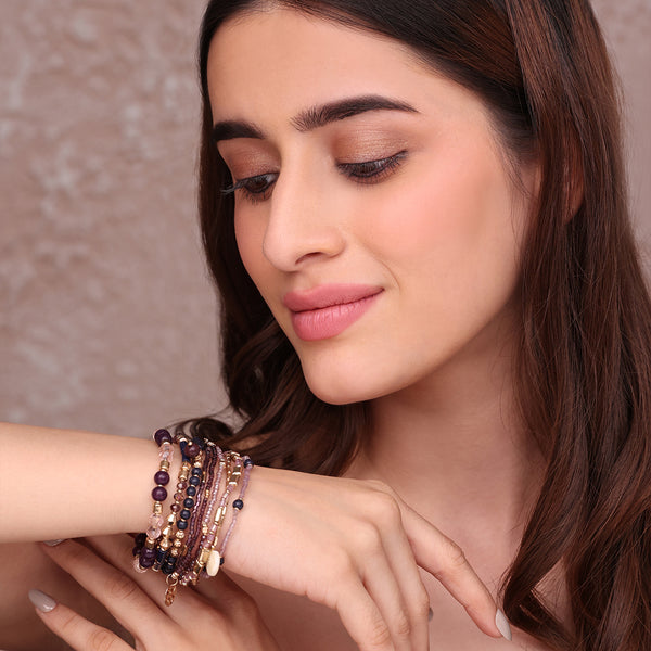 Set of Layered Bracelets with Purple, Pink, and Golden Beads