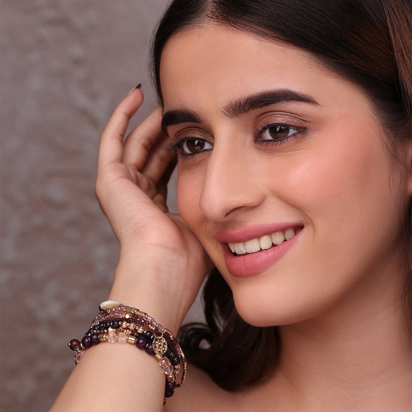 Set of Layered Bracelets with Purple, Pink, and Golden Beads