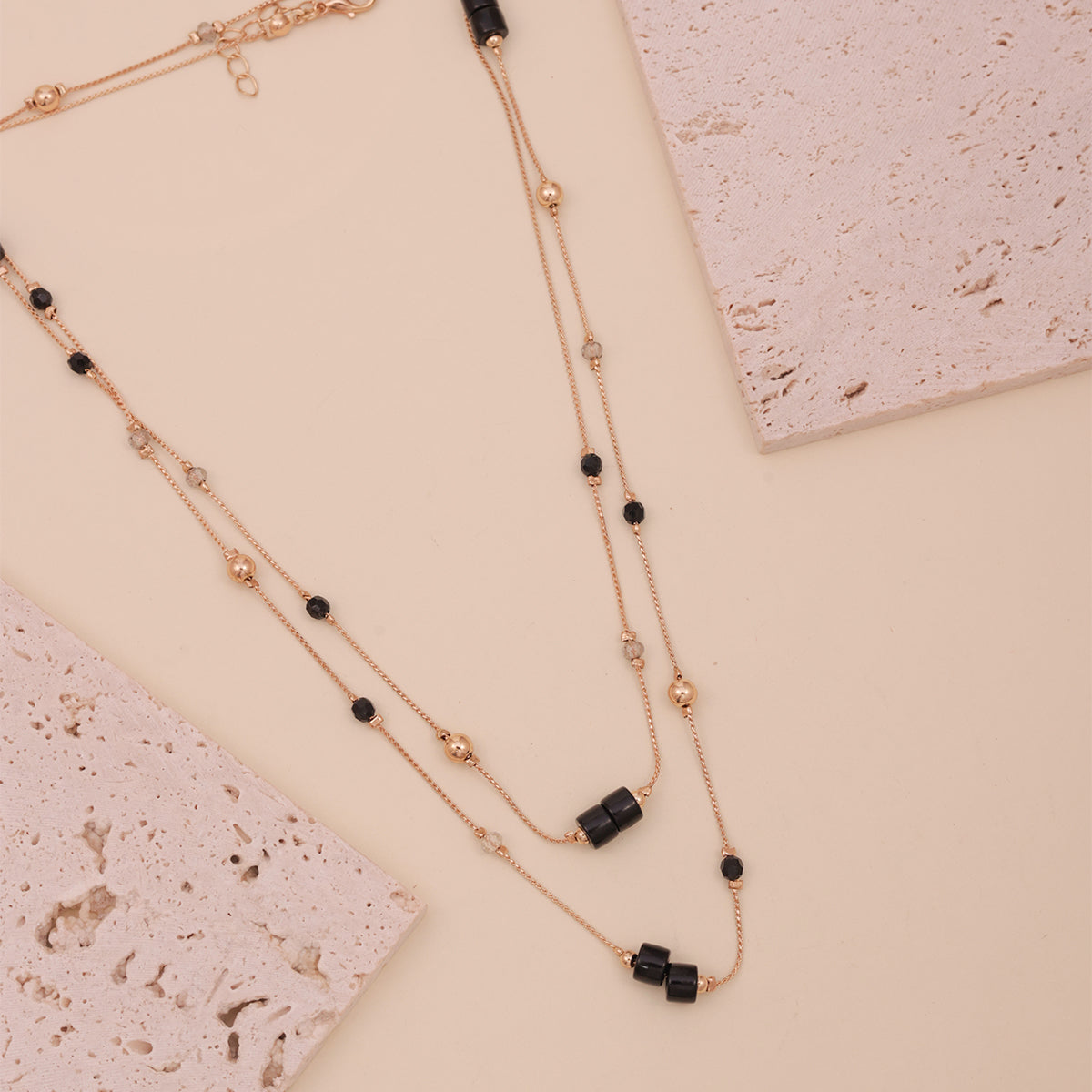 Golden Multi-Layered Necklace with Black Beads & Pearl Accents