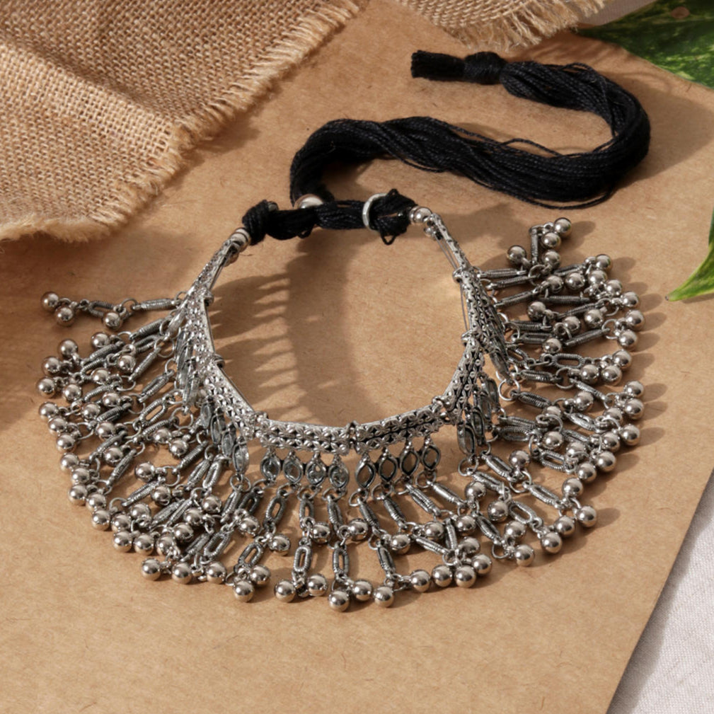 silver oxidised bell-like choker necklace with a mirrored design.