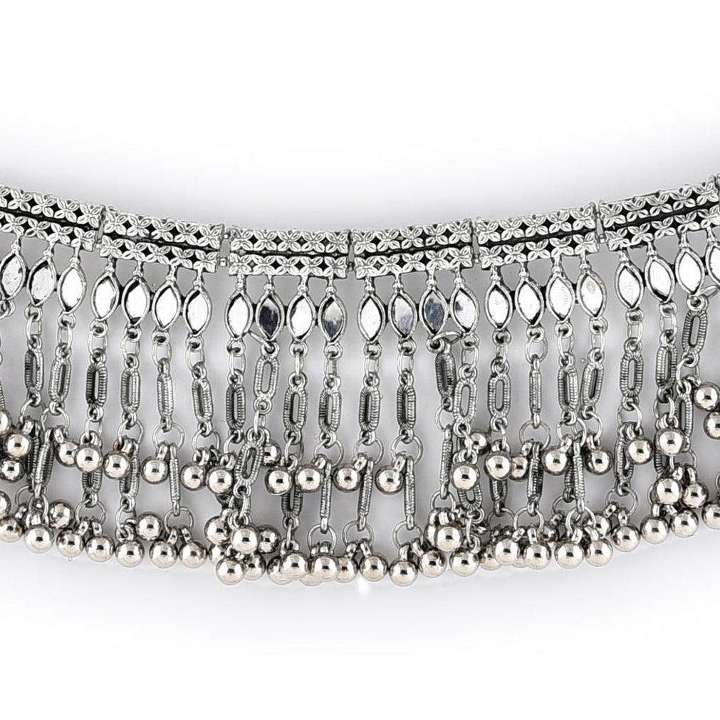 silver oxidised bell-like choker necklace with a mirrored design close-up