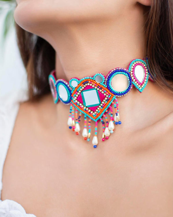 multicolor beaded choker necklace with geometric patterns and mirror accents close-up on model's neck