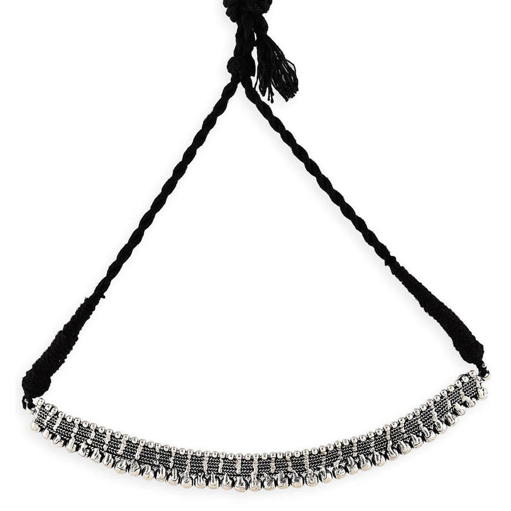 silver oxidised metal choker necklace with black thread on white background